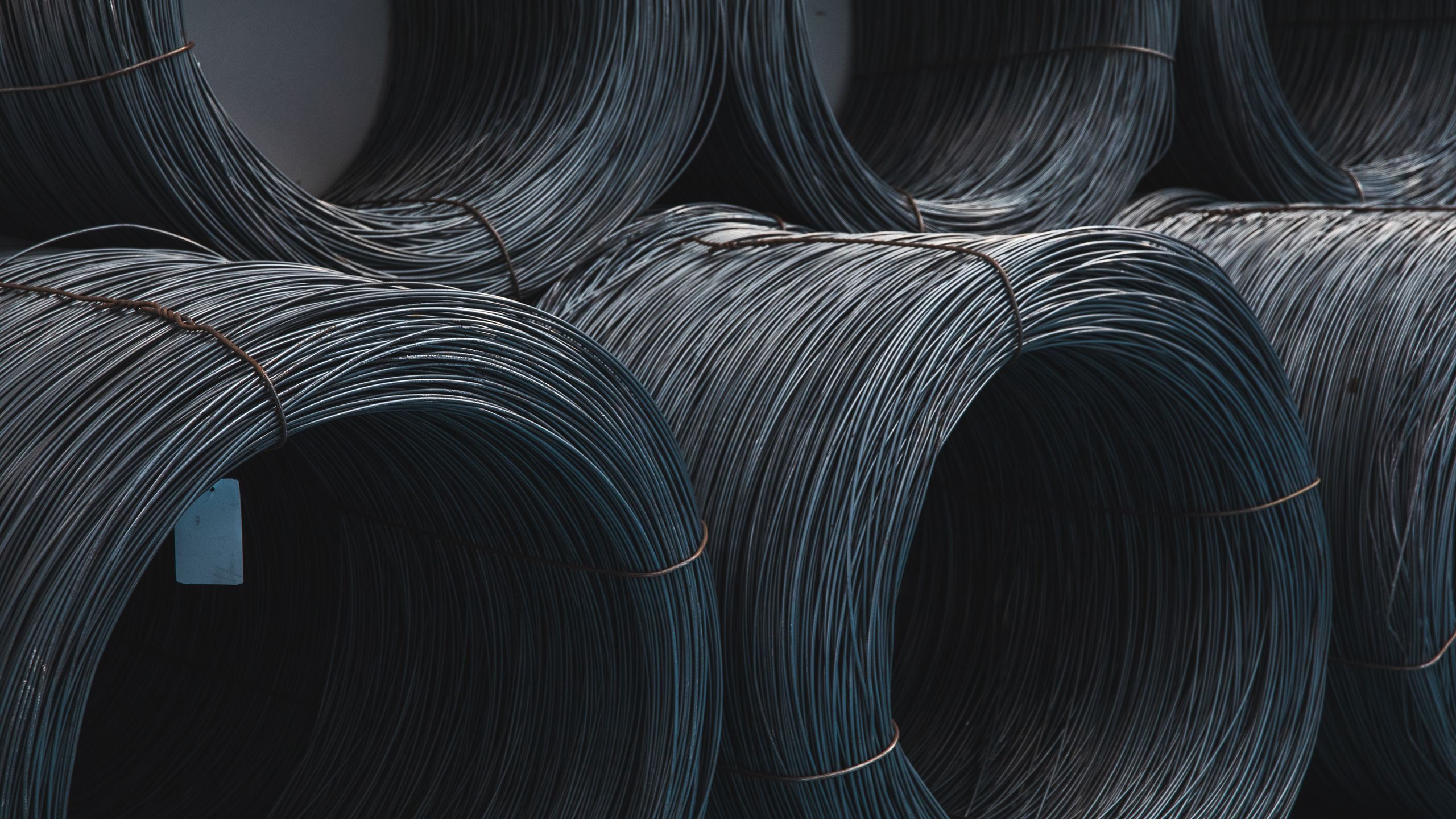 Tightly coiled steel wire rod stock, the principal raw material for cold forming.